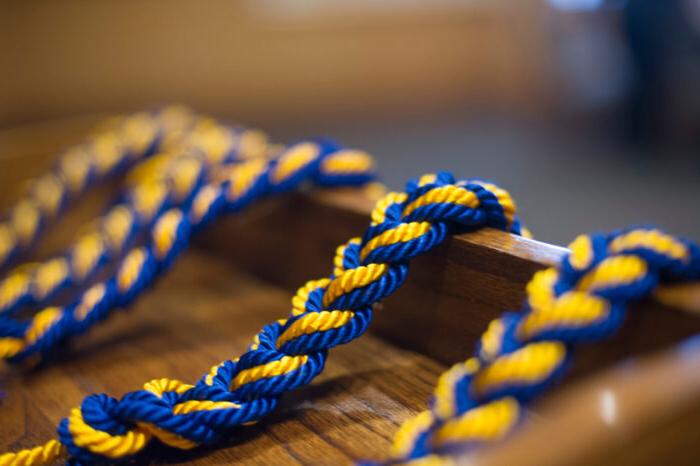 Blue and gold rope strung over a podium.